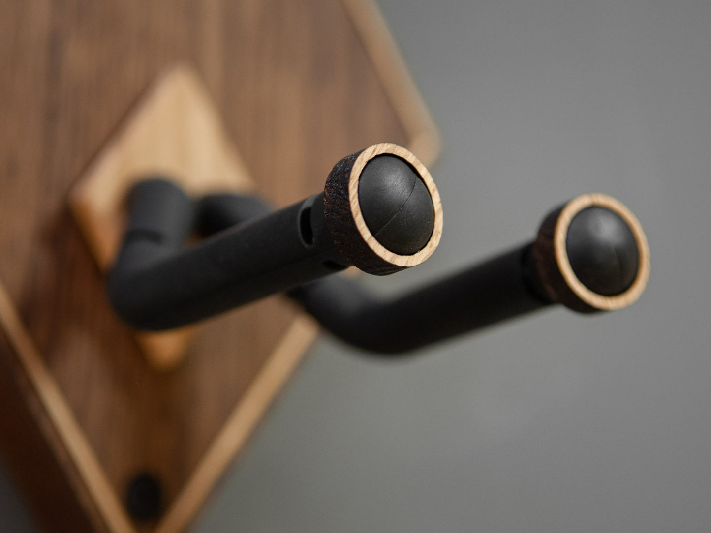 Light oak details of a guitar wall mount