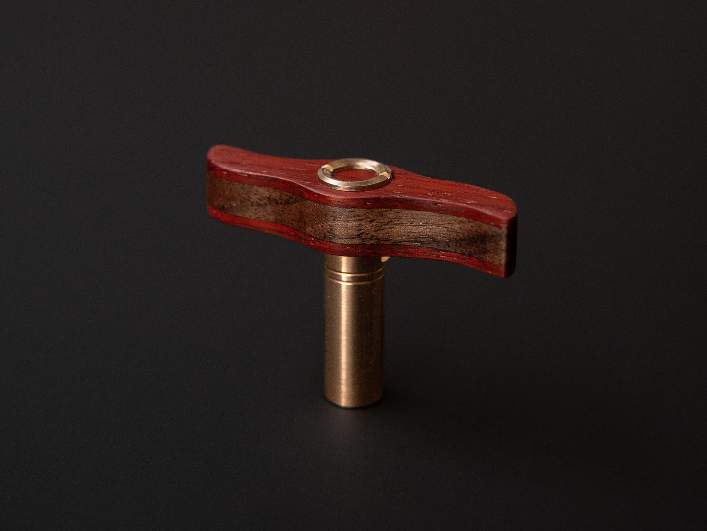 drum key made from walnut and padauk wood with brass details