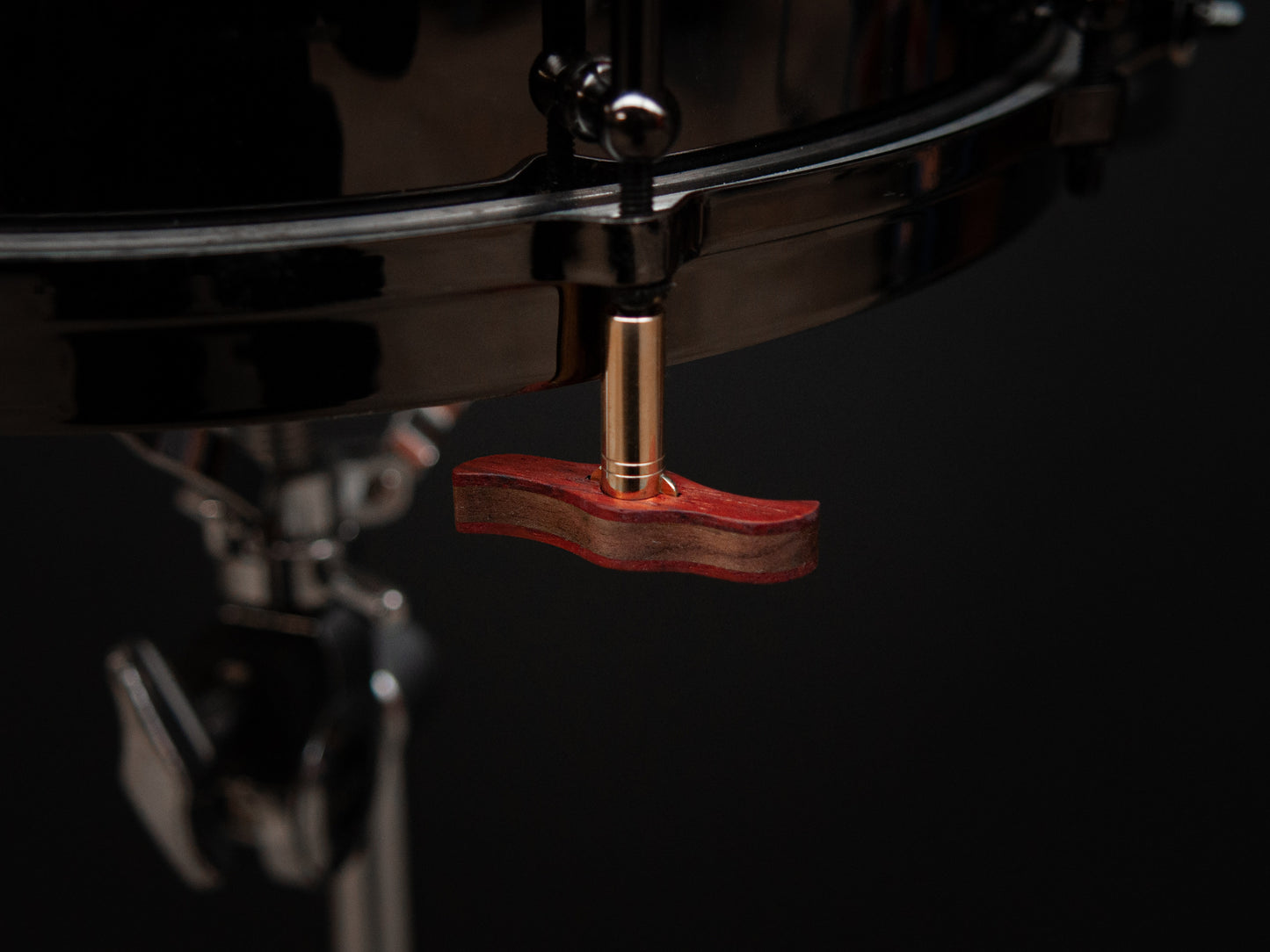 Imperial drum key displaying is magnetic feature, mounted upside down to the bottom of a drum