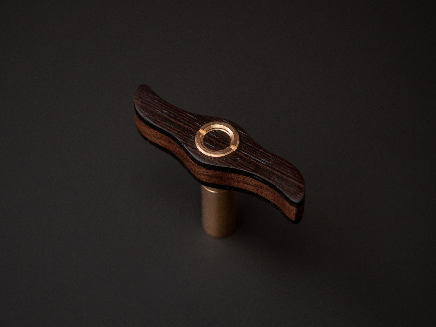 Topview of a handmade drum key, with wenge and brass details