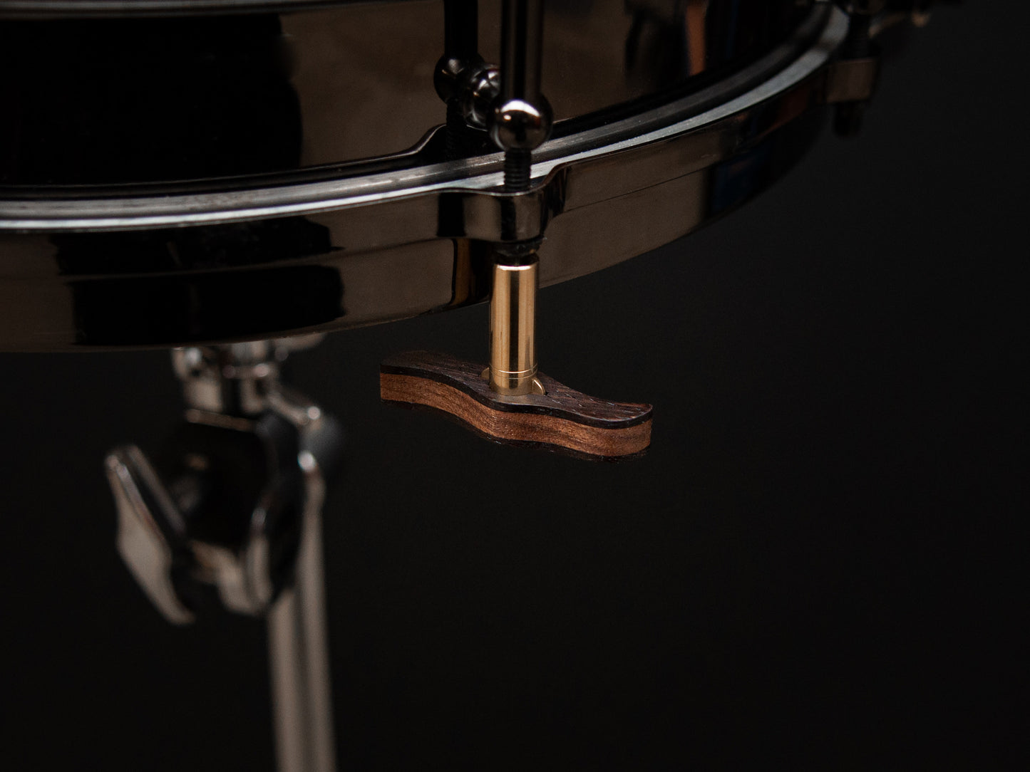 Imperial drum key displaying is magnetic feature, mounted upside down to the bottom of a drum