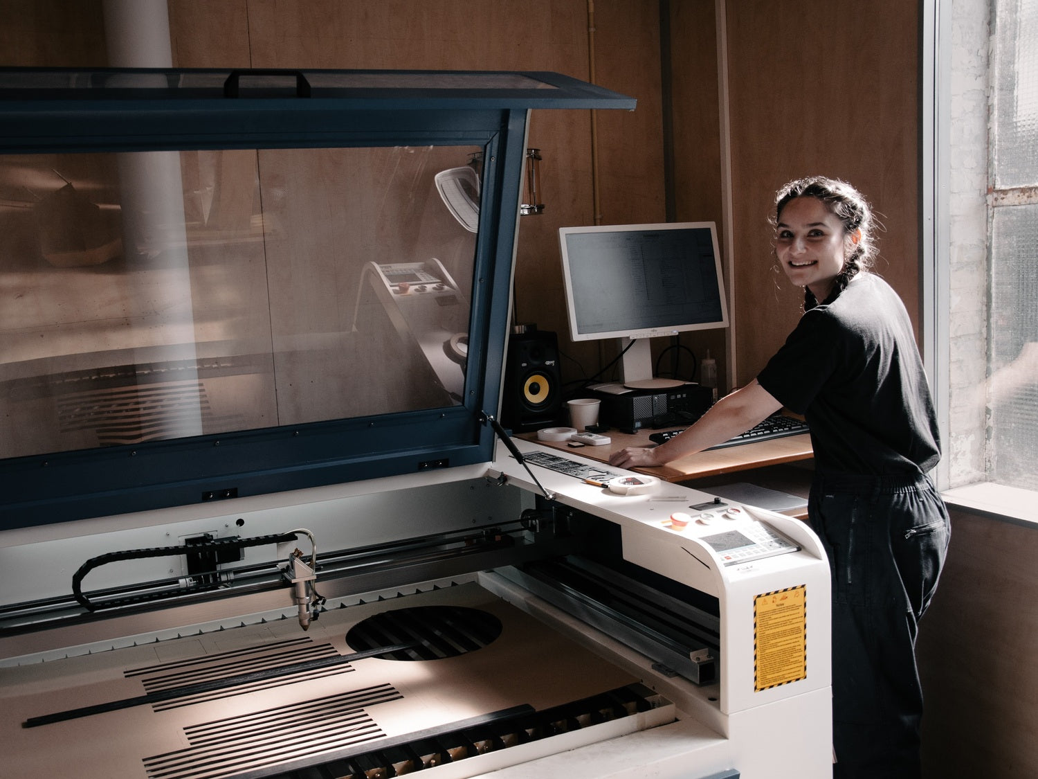 Cheryl at work with our lasercutter